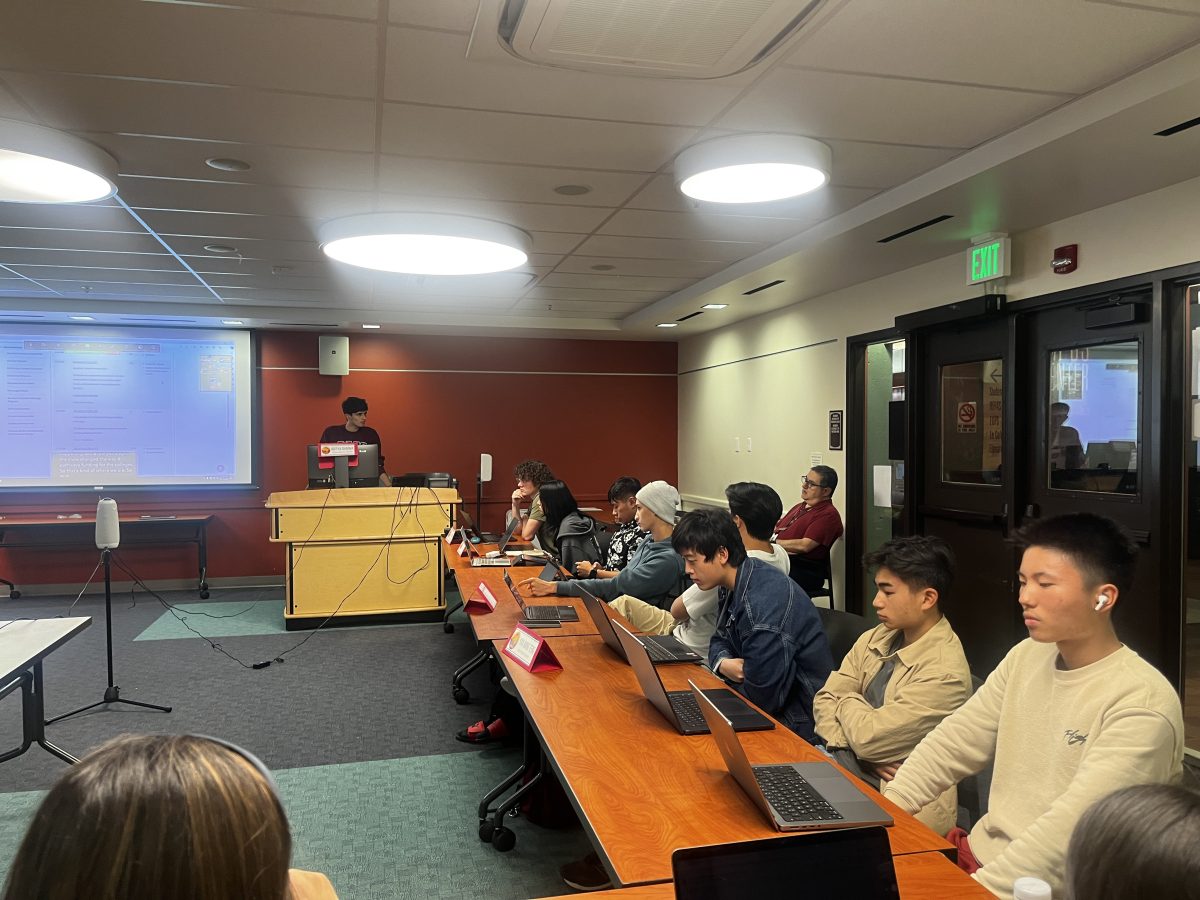 DASG Finance Committee Advisor Dennis Shannakian answers a prospective intern's question in the Student Council Chambers on Monday Oct. 14.