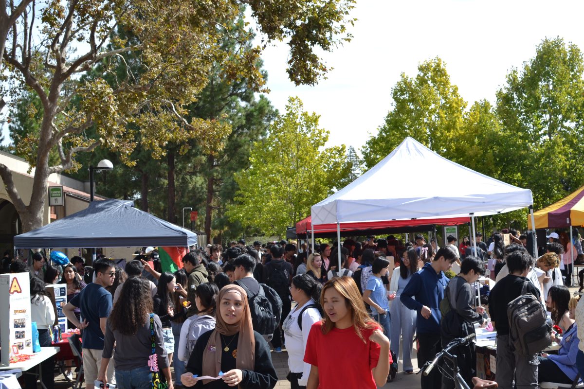 Students explore a variety of club booths, engaging with representatives and discovering opportunities to connect and get involved on campus in the Main Quad on Oct. 10.