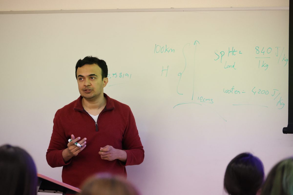 Neel Desai, a meteorology instructor, teaches his Weather and Climate Processes class at E32 on Oct. 9.