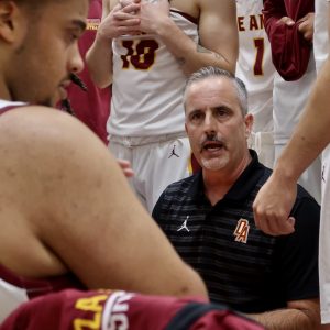 Head Coach Joe Berticevich gives direction to his team during a timeout during a game against San Jose City College at SJCC on Nov. 7.