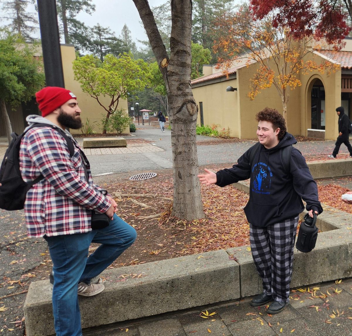 From left, Sammy Jacobs, 27, communications major and Noah Cildir, 18, psychology major, talk in the L quad on Nov. 28.