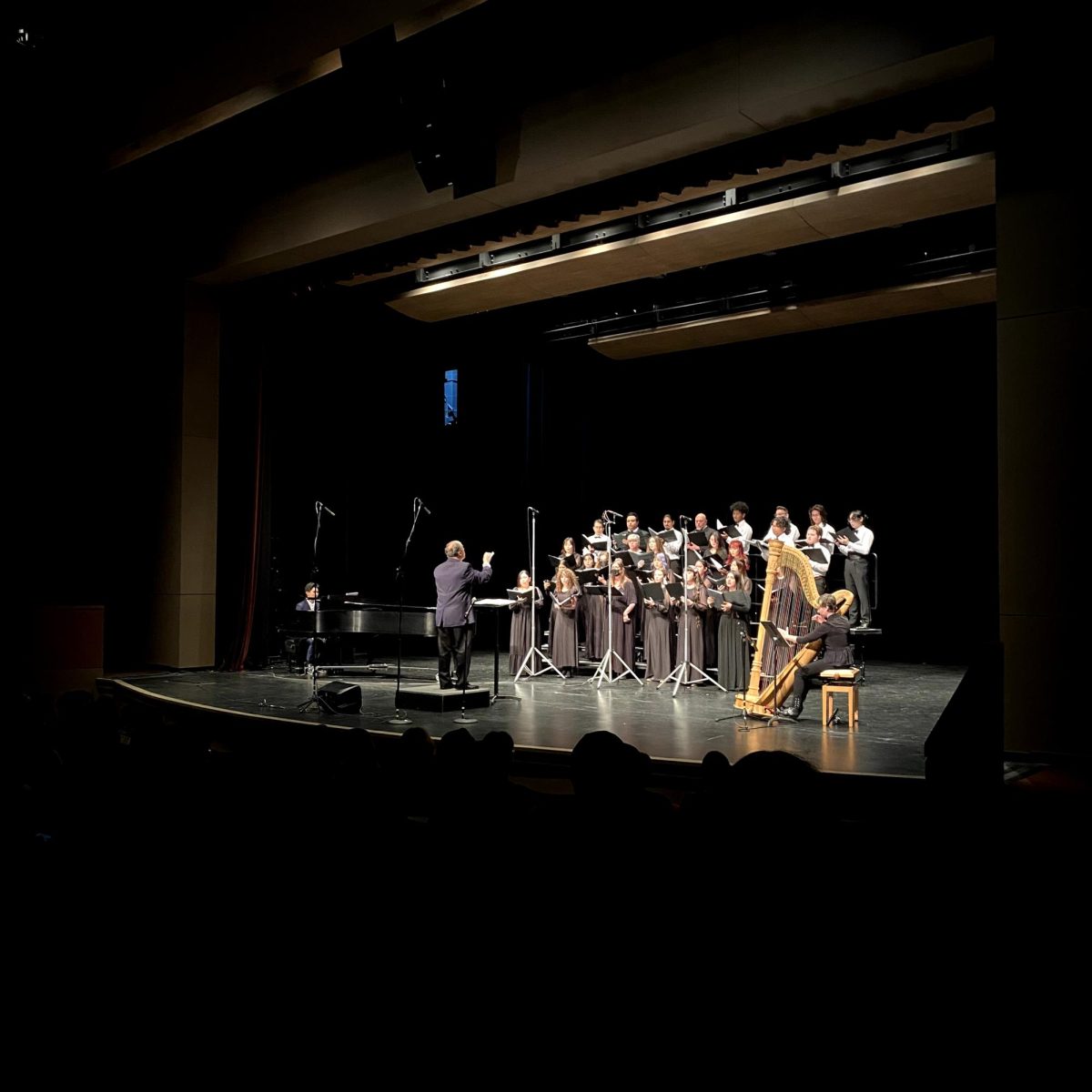 Cyril Deaconoff, Vintage Singers conductor, leads the choir during their performance at the Winter Celebration event in the Visual Performing Arts Center on Dec. 7.