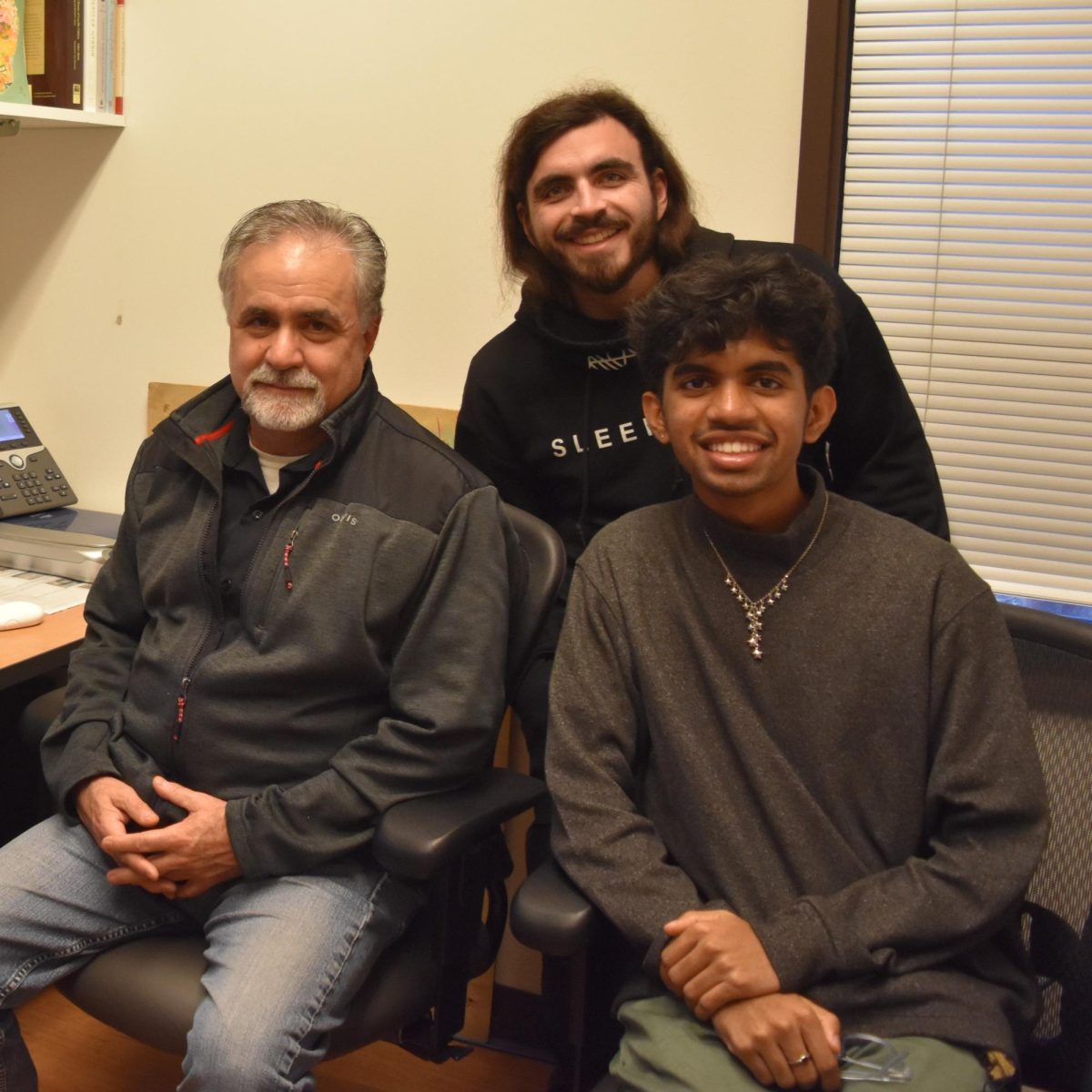 From left, Mike Appio, department chair, Frank Mayers, La Voz staff, and Atharva Salkar, La Voz staff pose for a photo in the La Voz podcast room on Dec. 12. 