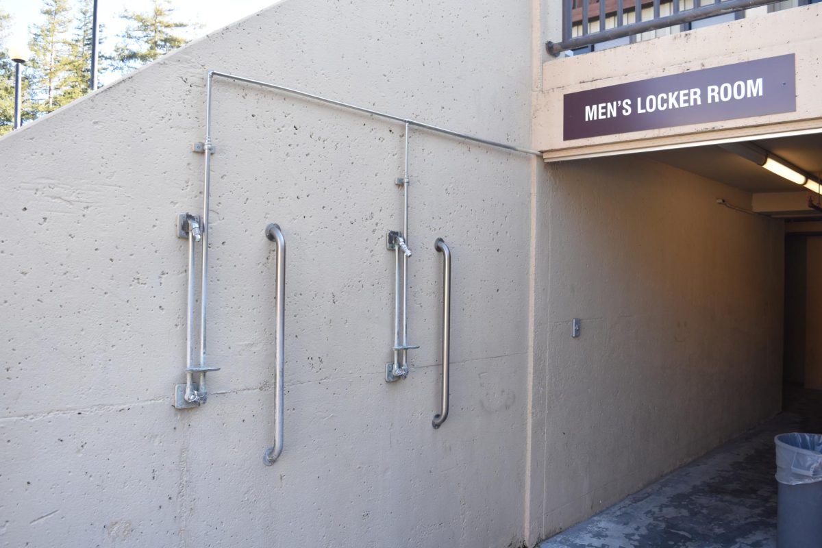 Outdoor showers built onto the wall next to the pools, outside the entrance to the men's locker room on Jan. 16.