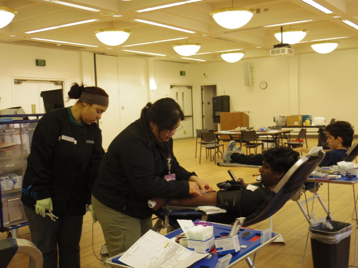 Anuraag Punnnam, 18, computer engineering major, watches as he gets his blood drawn on Jan. 30. 