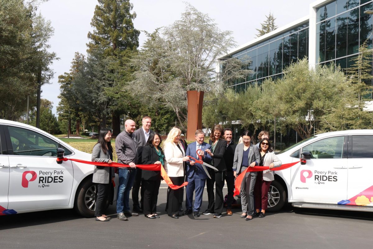 Sunnyvale City Mayor Larry Klein cuts the ribbon alongside key partners in the Peery Park Rides project, unveiling the new shuttle service for the city at the Synopsys headquarters on Mar. 4.