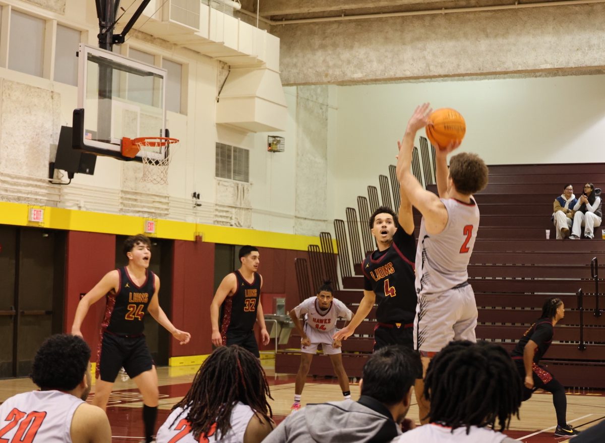 Owens tries to block guard Coby Christensen (Las Positas No. 2) from outside the three-point line.