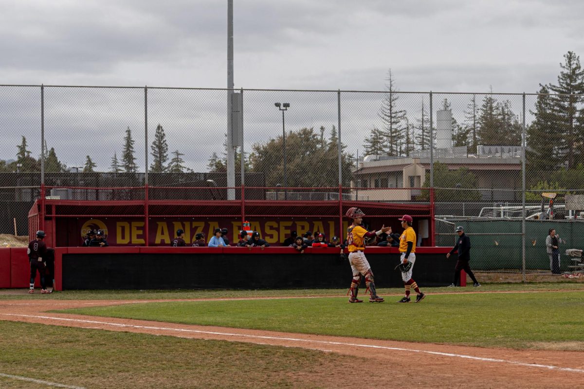From left, catcher Jordan Maske (De Anza No. 23), 19, communications major, and pitcher Kaleb Dela Cuesta Sato (De Anza No. 7), 20, business marketing major, celebrate the final out of the game at the De Anza baseball field on April 24.