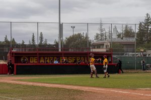 From left, catcher Jordan Maske (De Anza No. 23), 19, communications major, and pitcher Kaleb Dela Cuesta Sato (De Anza No. 7), 20, business marketing major, celebrate the final out of the game at the De Anza baseball field on April 24.