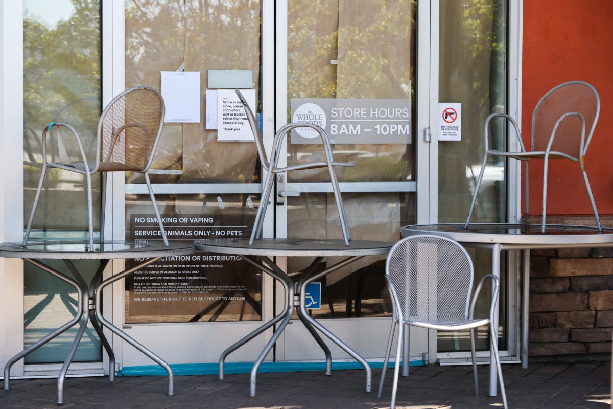 Chairs and tables sit stacked in front of the front doors of the Cupertino Whole Foods Market following its closure due to health code violations, photo on May 1.