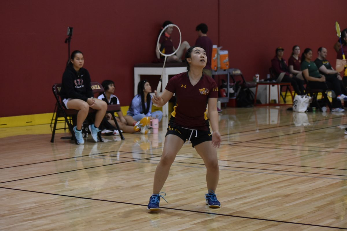 MaiLan Vuong, 19, business administration major, keeps an eye to the shuttlecock to win a score. The Mountain Lions compete in a home game at the De Anza College gymnasium on May 1 for the 2025 Coast Conference.
