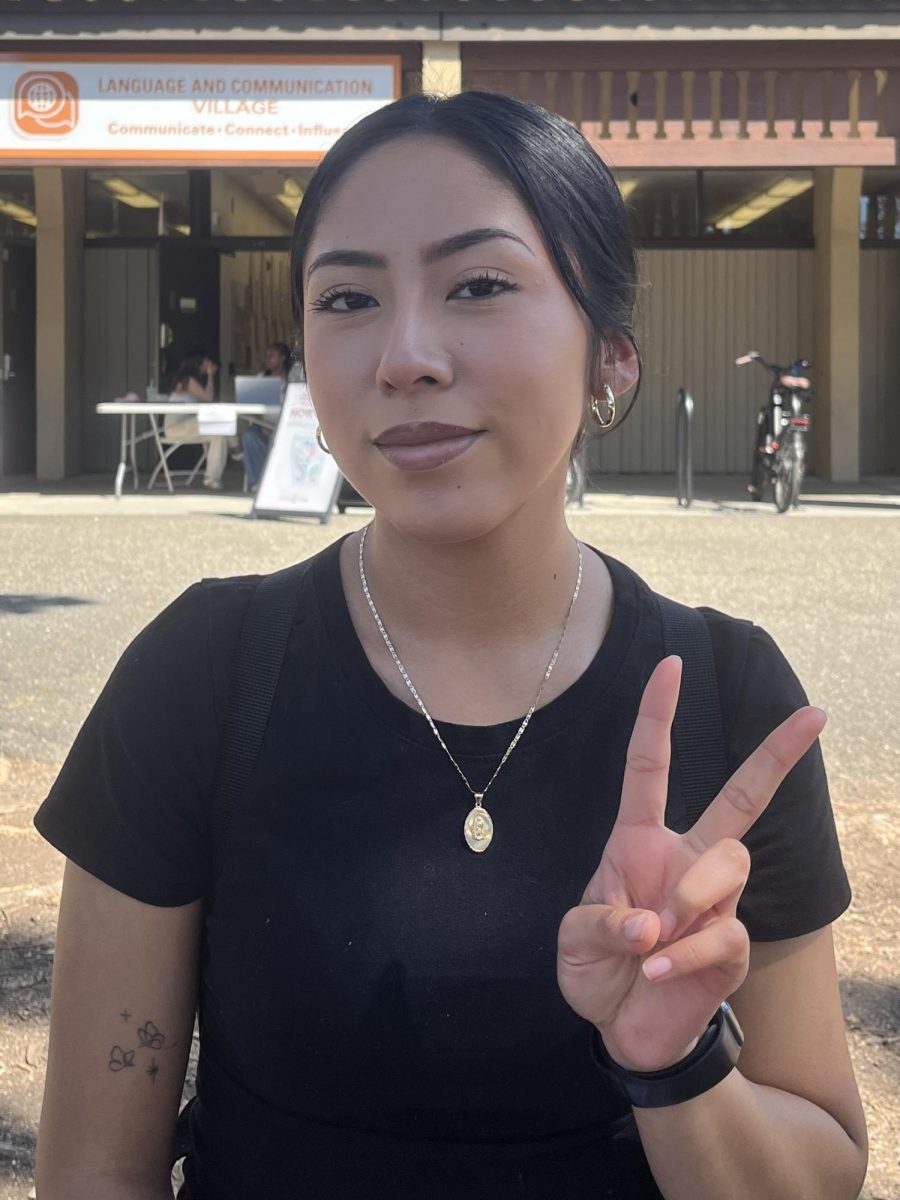 Evelyn Bello, 17, child development major, sits in front of the Language and Communication Village on Sept. 23.