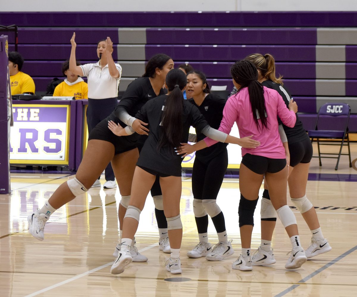 The De Anza women’s volleyball team rallies together after a block by Catalina Barajas (De Anza, No. 14) to take an 8-4 lead in the first set on Oct. 8.