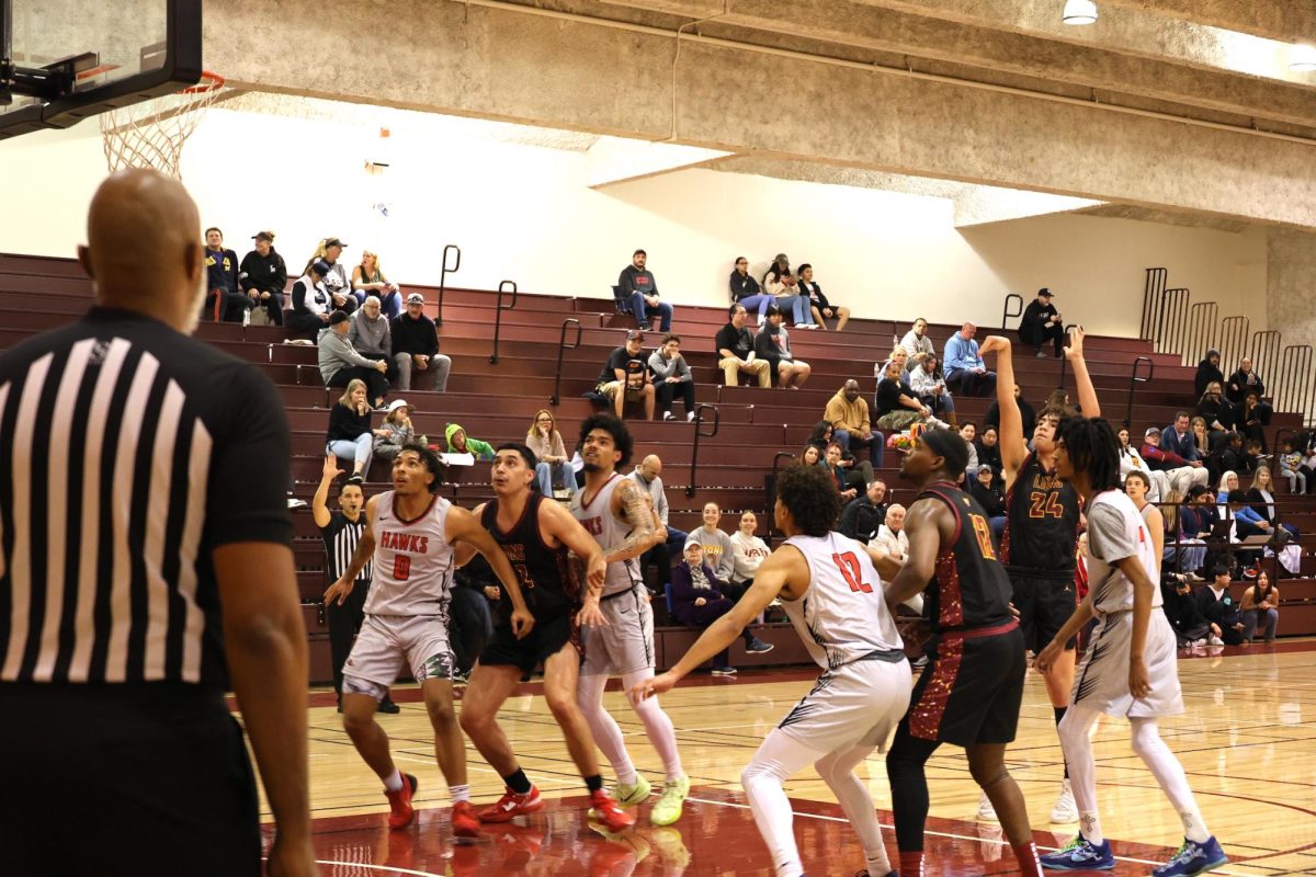 Guard and forward Theo McDowell (De Anza No. 24) throws a free throw as other players prepare for a rebound during a game against the Las Positas Hawks on Feb. 19. Archive photo.