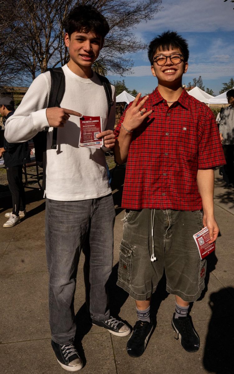 William Devanney (left), 18, a business major, and Edward Wong (right), 18, also a business major, wear contrasting outfits as Devanney opts for a monochrome look while Wong adds color.