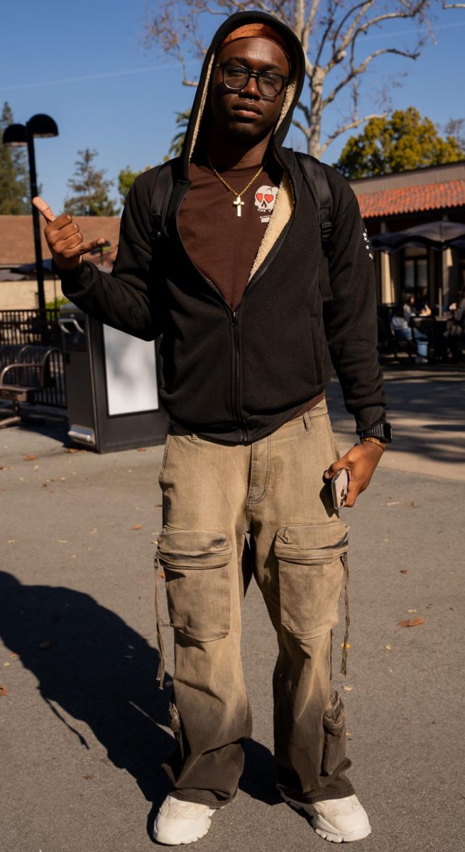 Jean Damas, 21, nursing major, color-coordinates his clothes to create a monochromatic outfit for school.