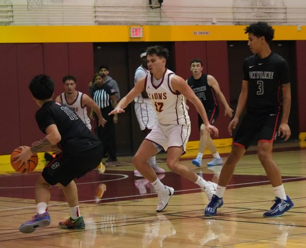 Guard Gio Brovelli (De Anza No. 12), 19, business administration major, blocks Trojan point guard Branden Antiporda (Skyline No. 11) from scoring at the De Anza College Main Gym on Feb. 20.
