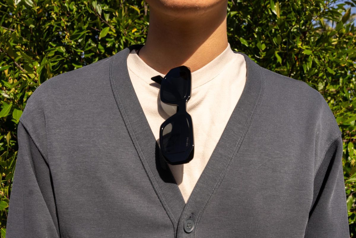 Xinbo Zhang, 18, economics major, keeps his outfit simple yet elegant, with contrasting colors drawing attention to his Prada sunglasses.