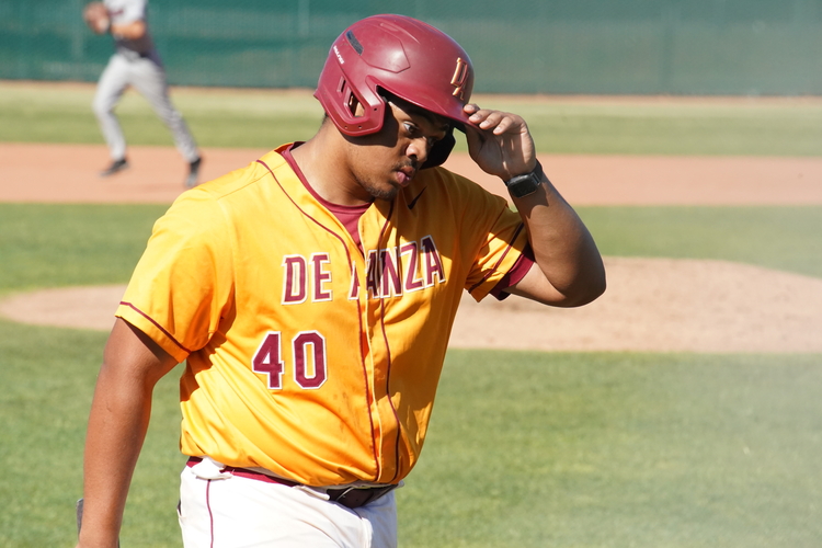 Designated hitter Lawson Darthard (De Anza No. 40) walks to the dugout after the inning ends on March 19.