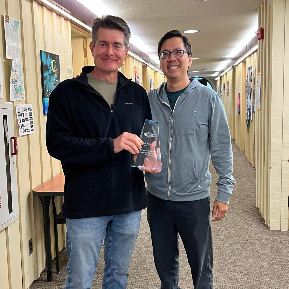 Robert Stockwell holds his "Advocate of the Year" award in the F2 building on Feb. 25.