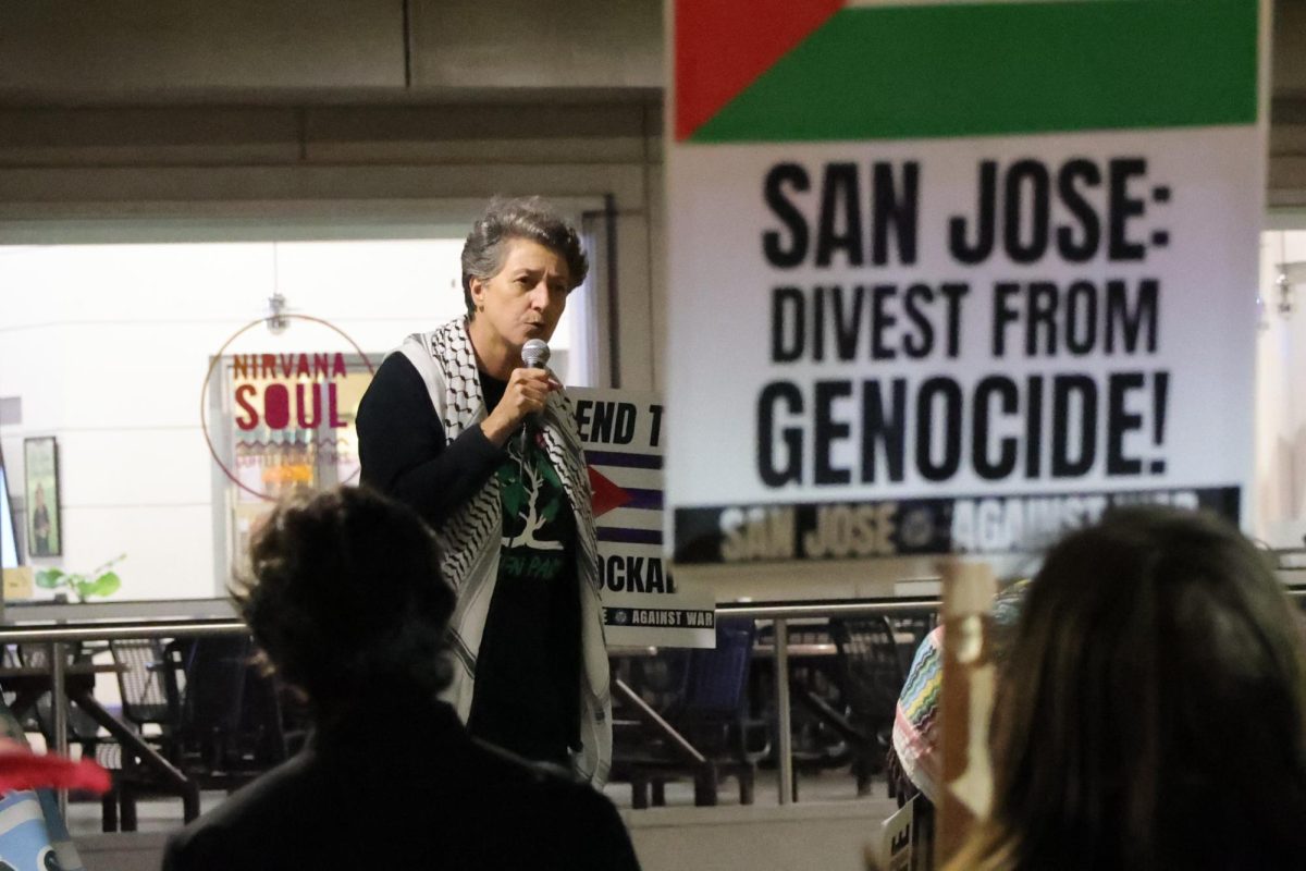 Nassim Nouri, Green Party of Santa Clara County Councilmember, gives a speech in front of protesters about Cuba's strength through adversity, at Martin Luther King Jr. Library in San Jose on March 3.