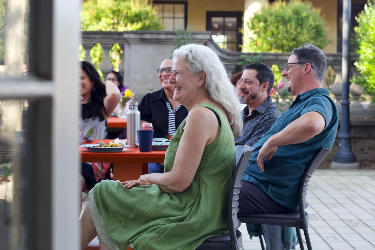 Cynthia Kaufman, sits with colleagues at her retirement party on March 18. Kaufman has been at De Anza for 34 years.