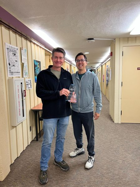 James Nyugen stands with Robert Stockwell, who shows off his "Advocate of the Year" award in the F2 building on Feb. 25.
