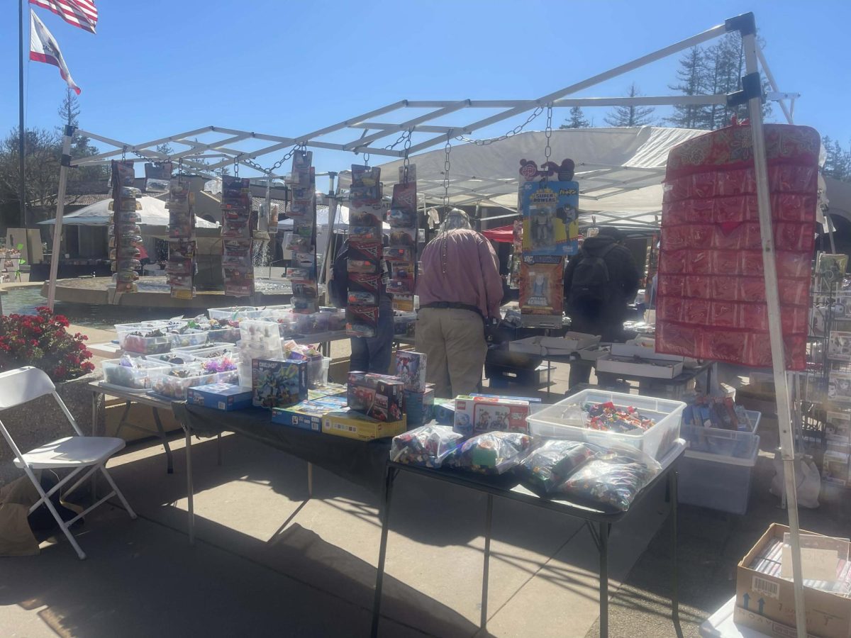 Jonathan Hammer's stall displays collectible toys that attracts students on campus at the main quad on Wednesday, March 11.