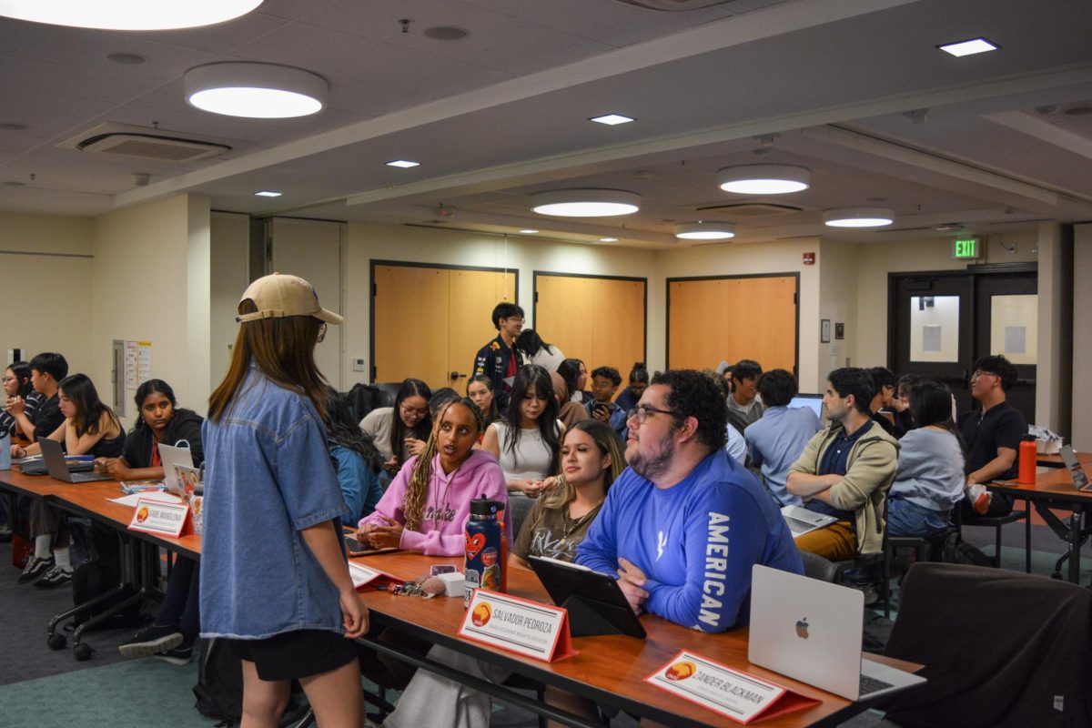 At the DASG meeting, discussions carry throughout the crowd in the Student Council Chamber on May 13. Members of the board debate whether or not certain budgets should be passed.