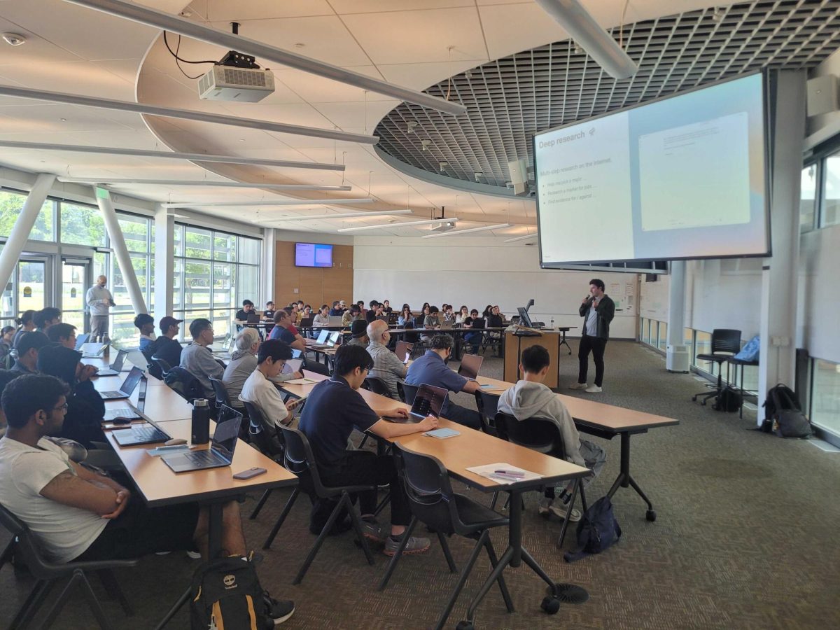 OpenAI Academy attendees listen as OpenAI Go-To-Market Staff Member Sean Lubbers provides instructions for an exercise in MLC 103 on May 9. 
“Our district is trying to position itself to be a leader in the AI space,” the district's Vice Chancellor of Technology and Innovation Jory Hadsell said. “To help ensure we have all the programs that our students will need to be able to find the best employment and have the best career opportunities.”