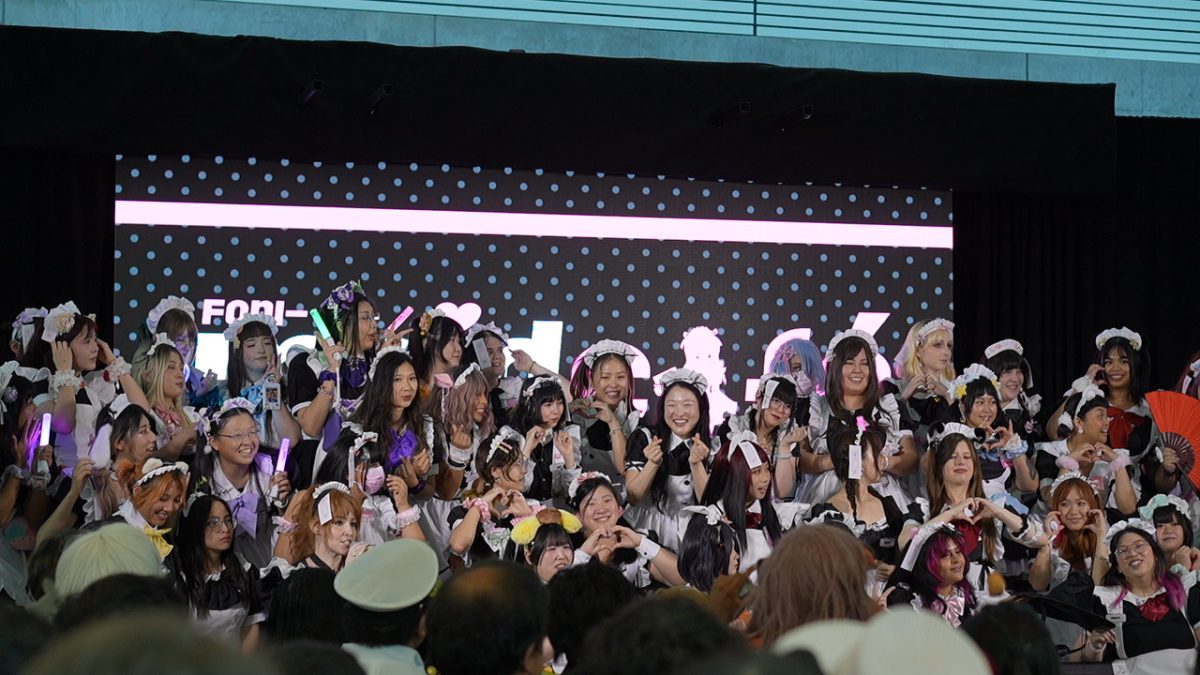 Members of Fanimaid Café pose for fans on Stage Zero on May 24. Fanimaid Café provides food and perfors at the San Jose McEnery Convention Center and the Hyatt hotel.