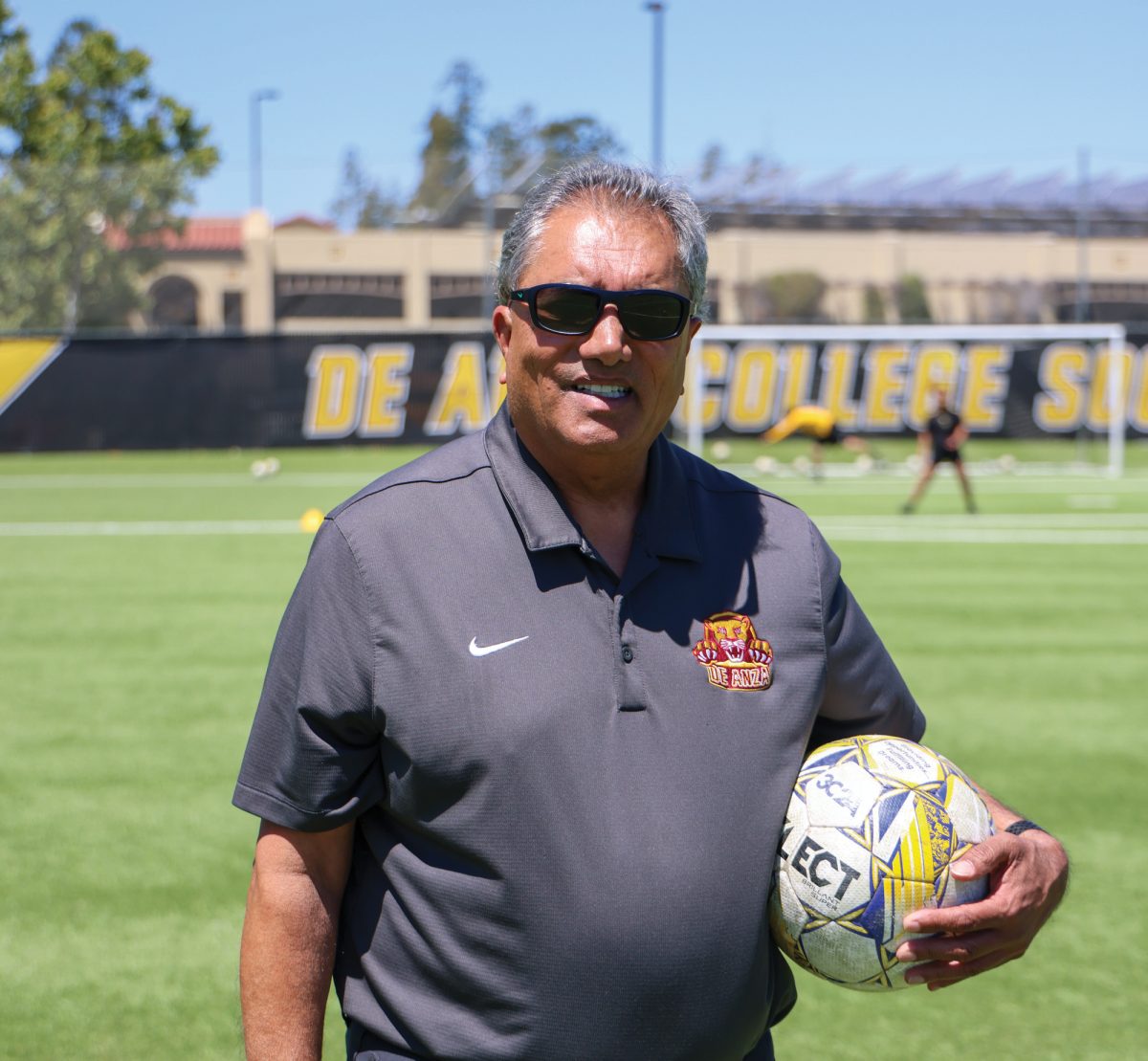 Former De Anza athletic director and soccer coach Kulwant Singh holds a soccer ball at the soccer field on May 19.  Singh will be inducted into the National Association of College Directors of Athletics hall of fame on June 8.