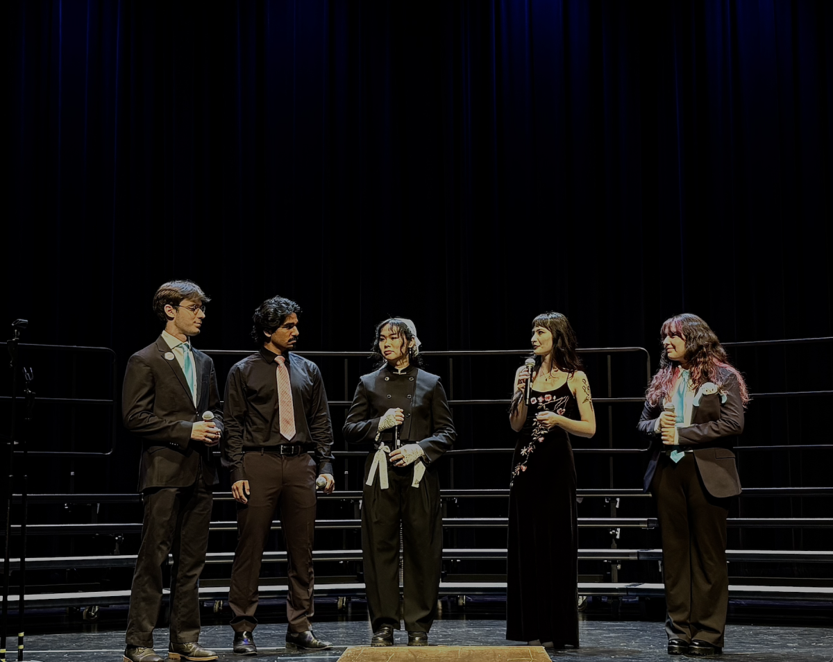 Joshua Hackworth (left), Alexander Reyes, Xingyuan Song, Alana Lin and Abril Torres of the a cappella jazz group Vocal Flight perform a three-song medley at the De Anza Concert Band and Choir spring concert on June 13.